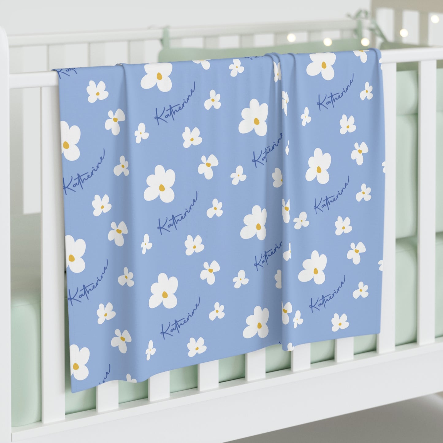 Jersey personalized baby blanket in blue daisy pattern laid flat