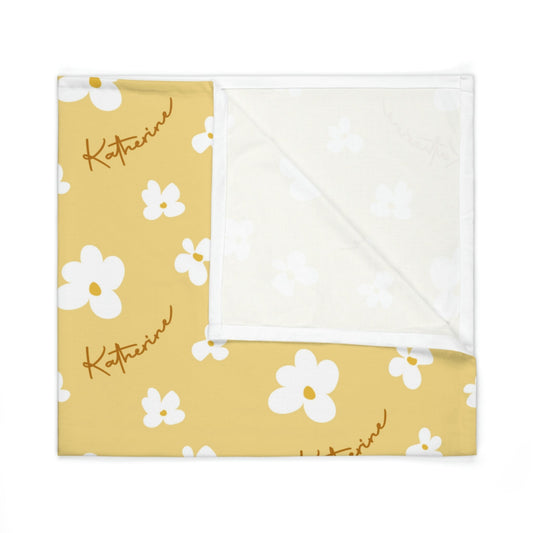 Folded jersey fabric personalized baby blanket in yellow daisy pattern