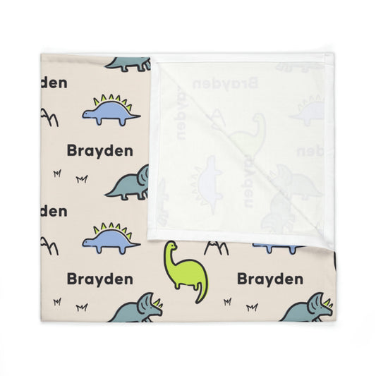 Folded jersey fabric personalized baby blanket in dinosaur pattern