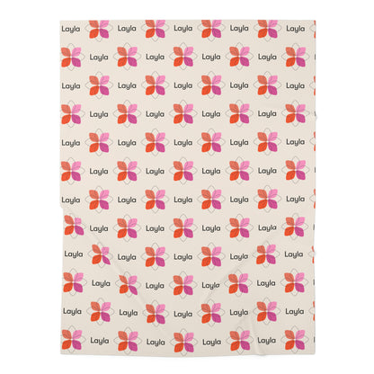 Jersey personalized baby blanket in pink boho geometric flower pattern laid flat