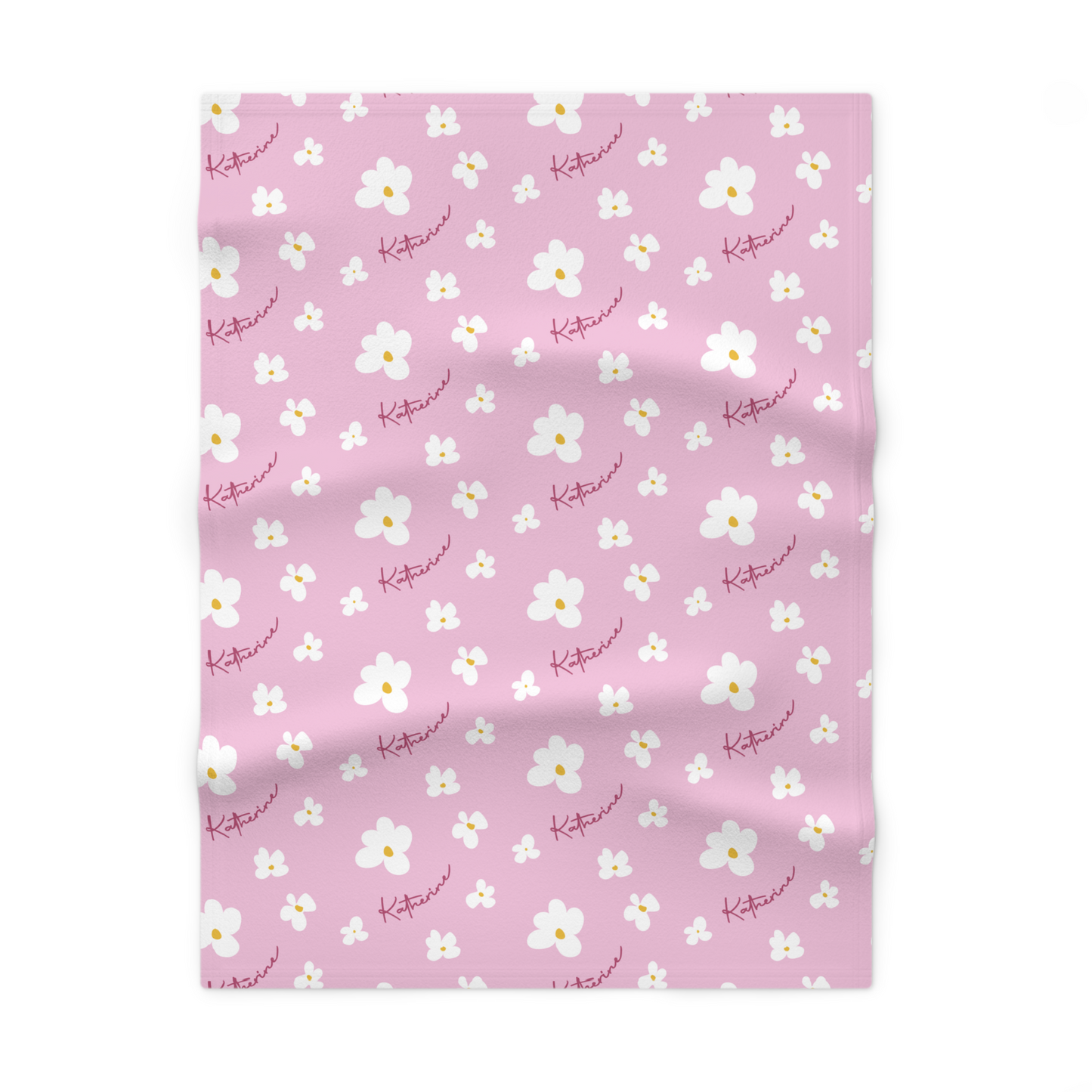 Fleece personalized baby blanket in pink daisy pattern laid flat