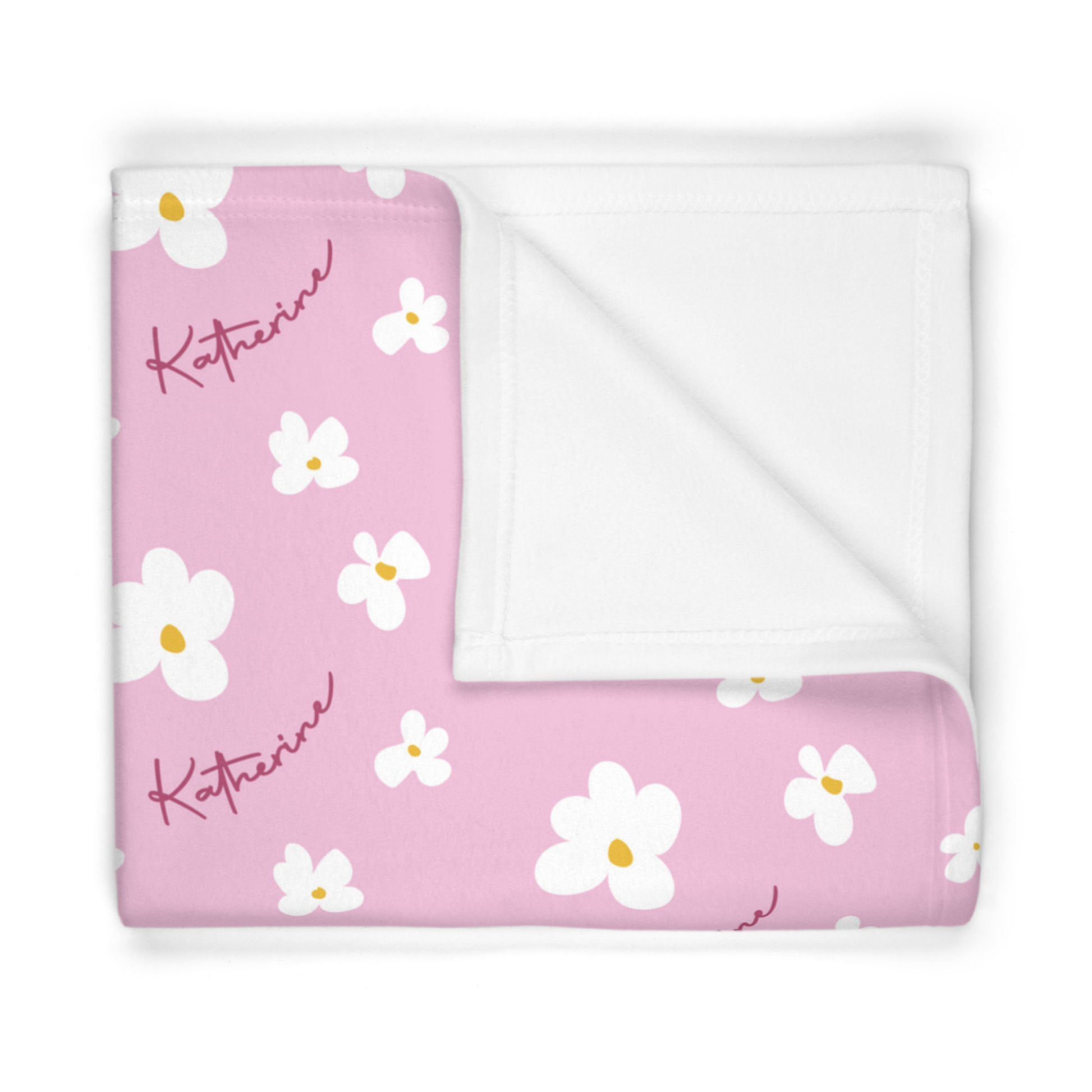 Folded fleece fabric personalized baby blanket in pink daisy pattern