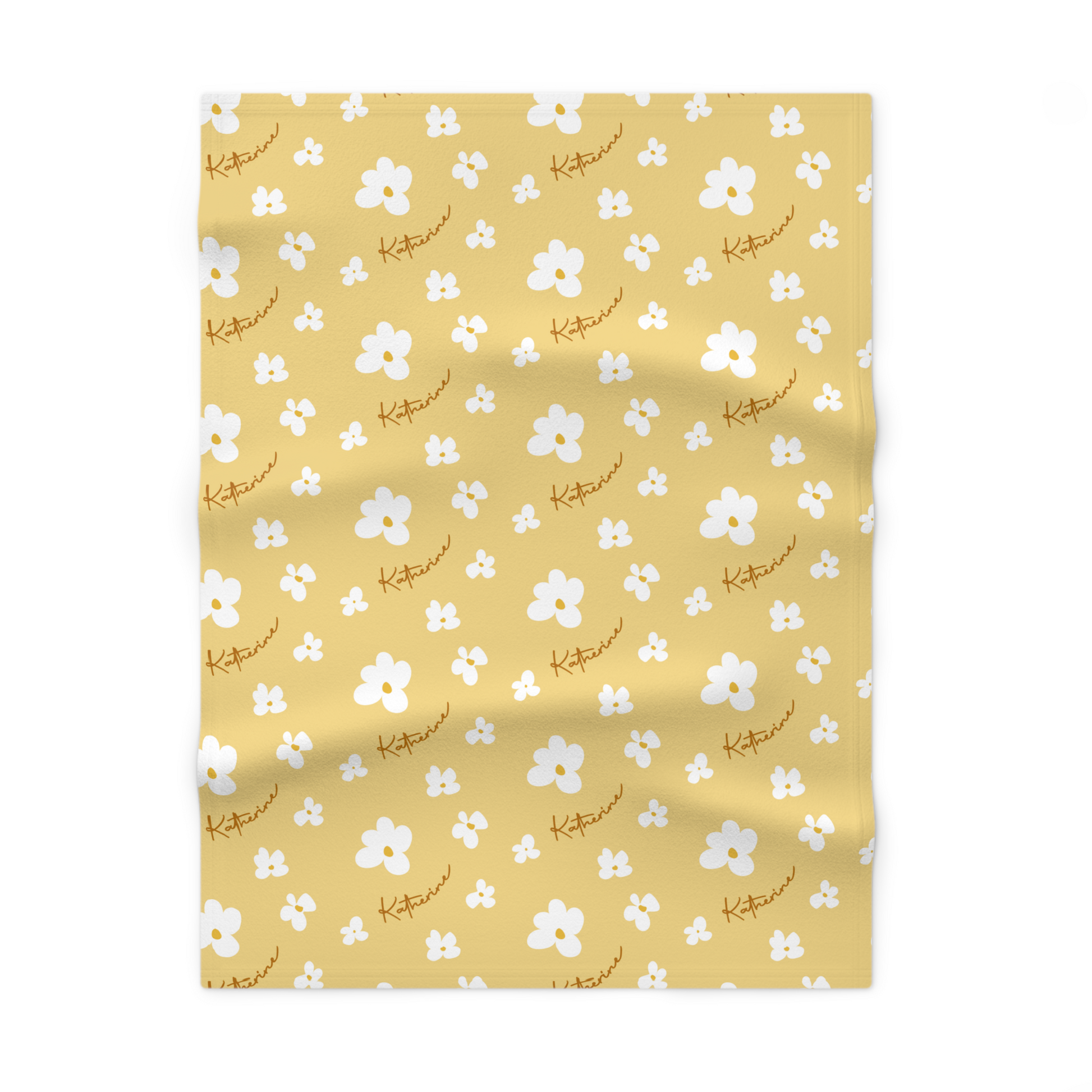 Fleece personalized baby blanket in yellow daisy pattern laid flat