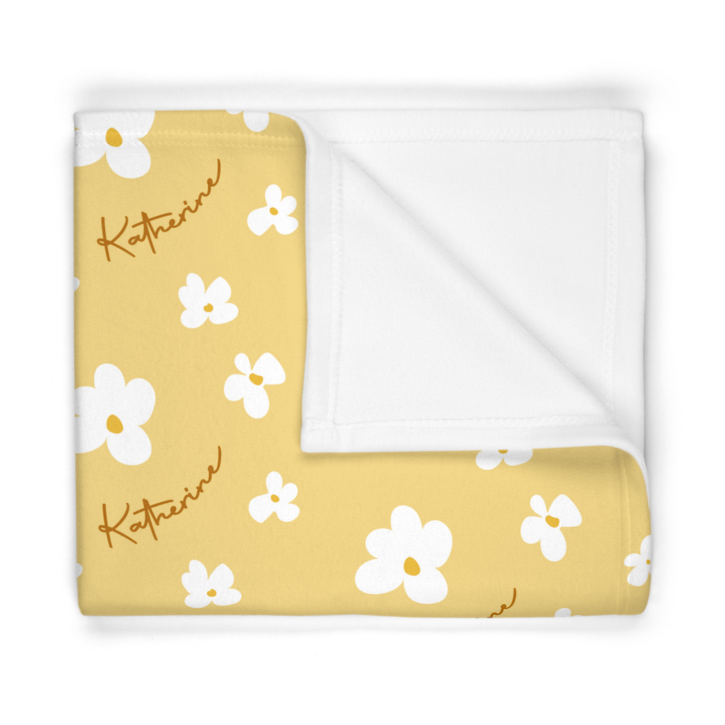 Folded fleece fabric personalized baby blanket in yellow daisy pattern
