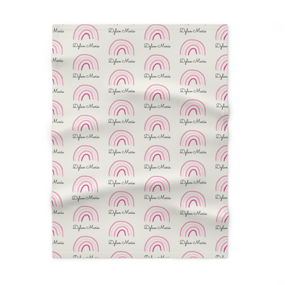 Fleece personalized baby blanket in pink rainbow pattern laid flat
