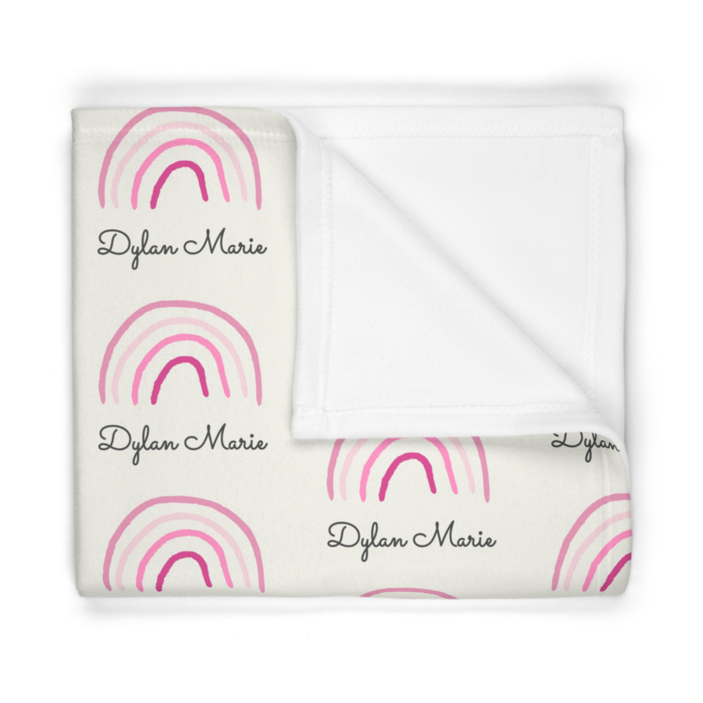 Folded fleece fabric personalized baby blanket in pink rainbow pattern