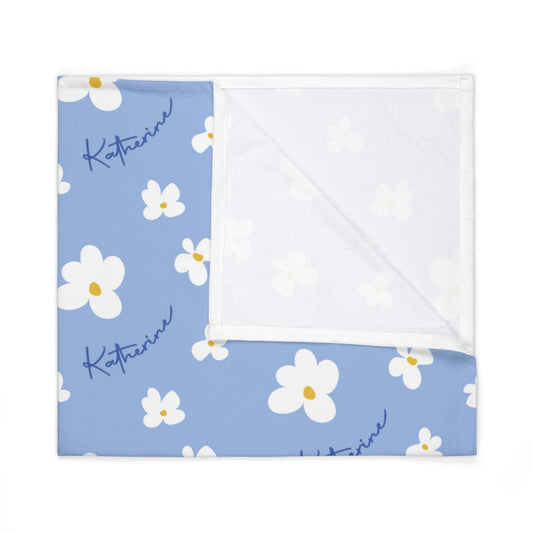 Folded jersey fabric personalized baby blanket in blue daisy pattern