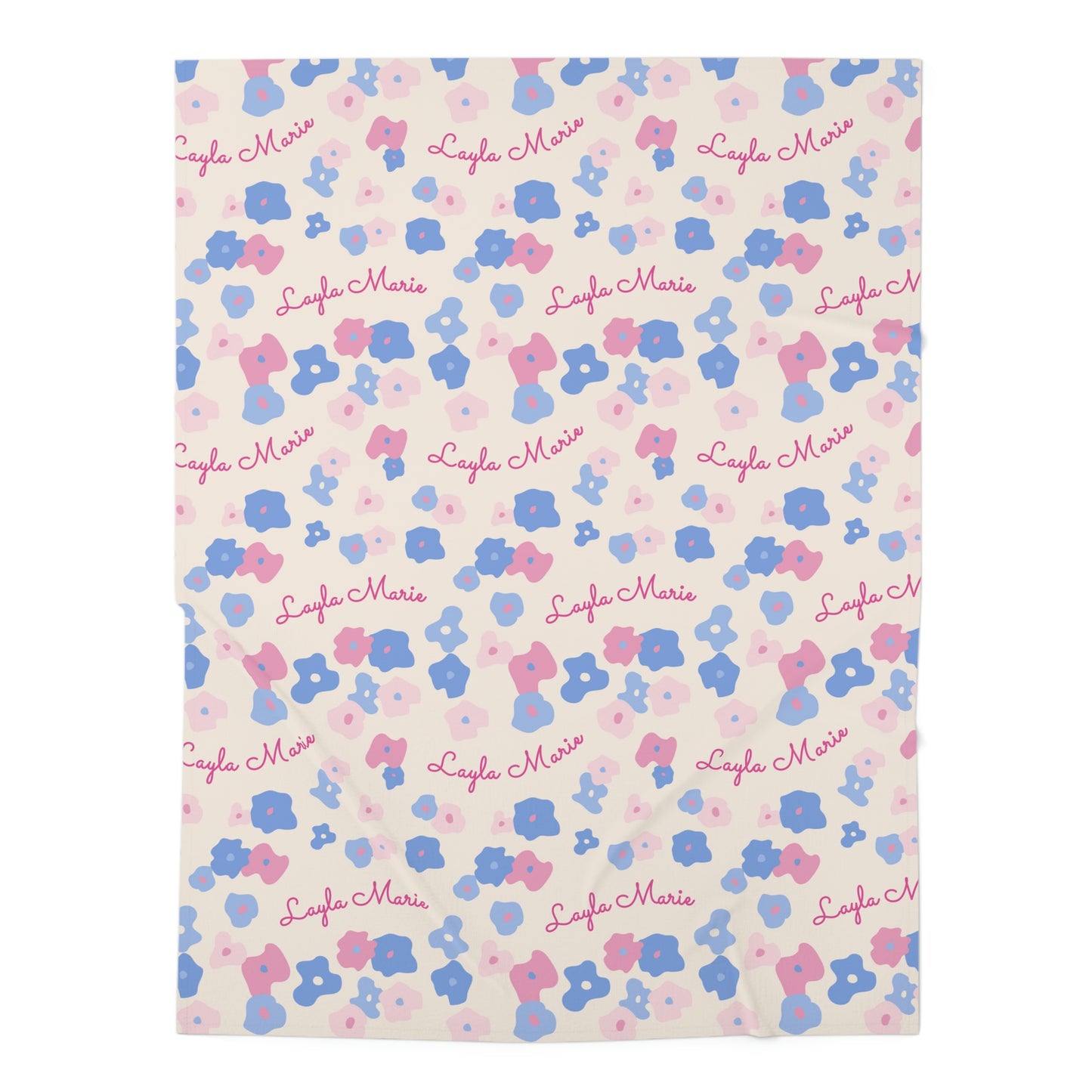 Jersey personalized baby blanket in graphic pink and blue daisy pattern laid flat