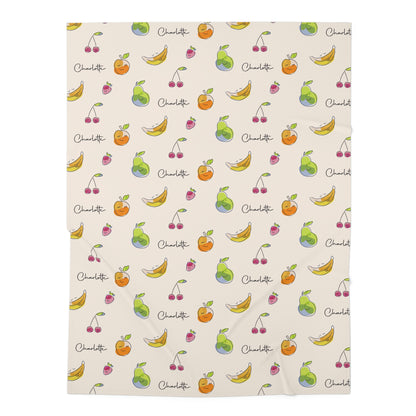 Jersey personalized baby blanket in happy fruit pattern laid flat
