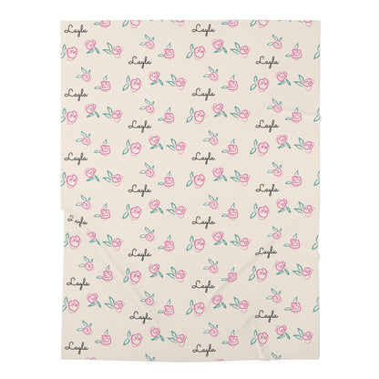 Jersey personalized baby blanket in pink rose with green leaves pattern laid flat