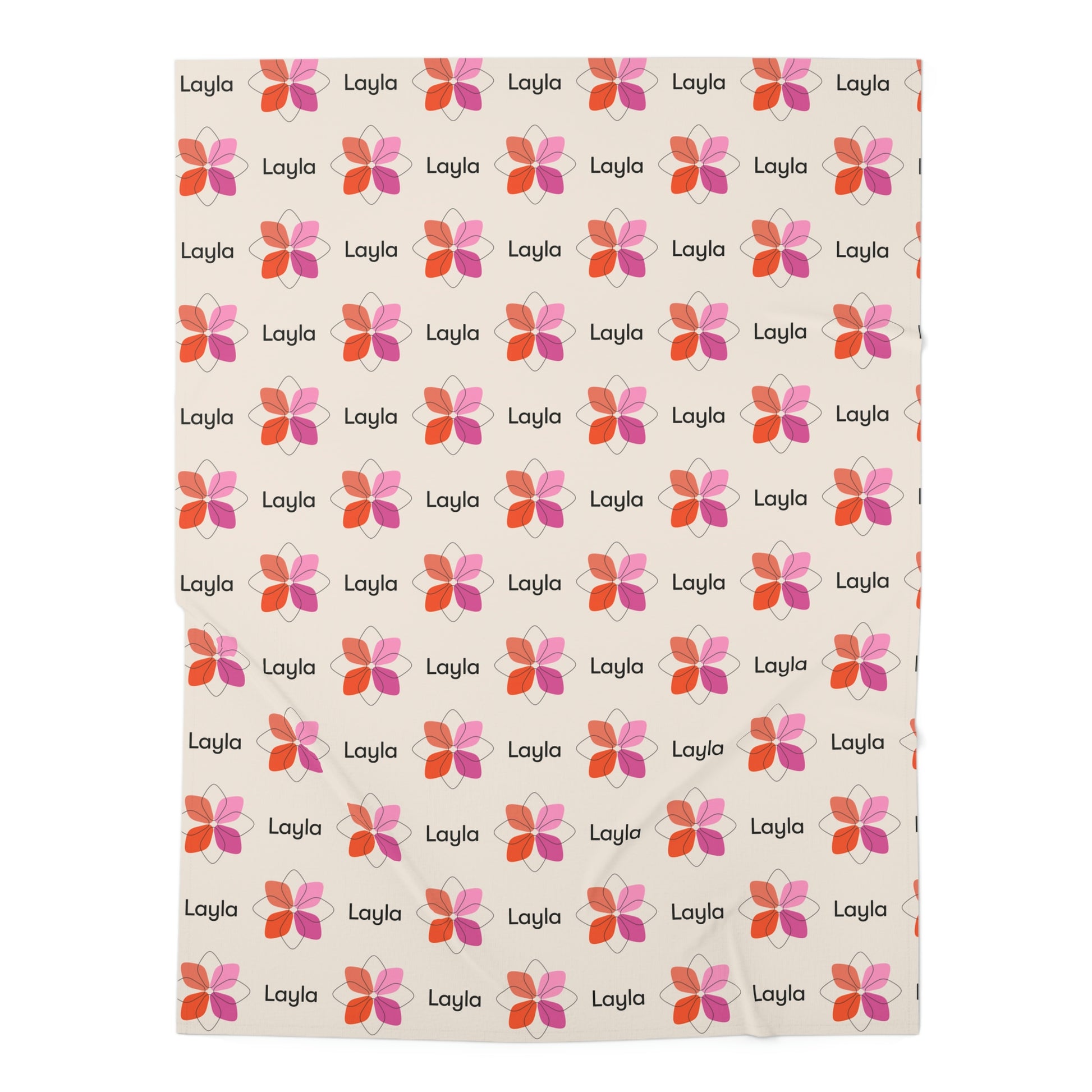 Jersey personalized baby blanket in pink boho geometric flower pattern laid flat