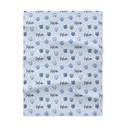 Fleece personalized baby blanket in blue cuddly bear pattern laid flat