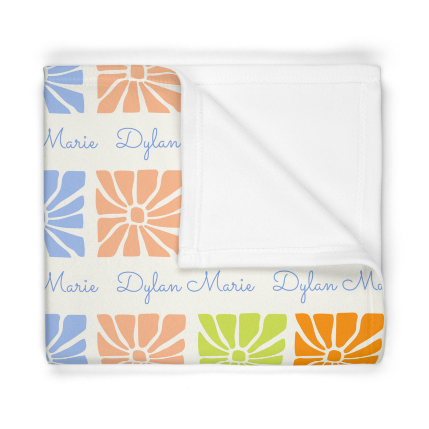 Folded fleece fabric personalized baby blanket in a multi-colored boho flower pattern