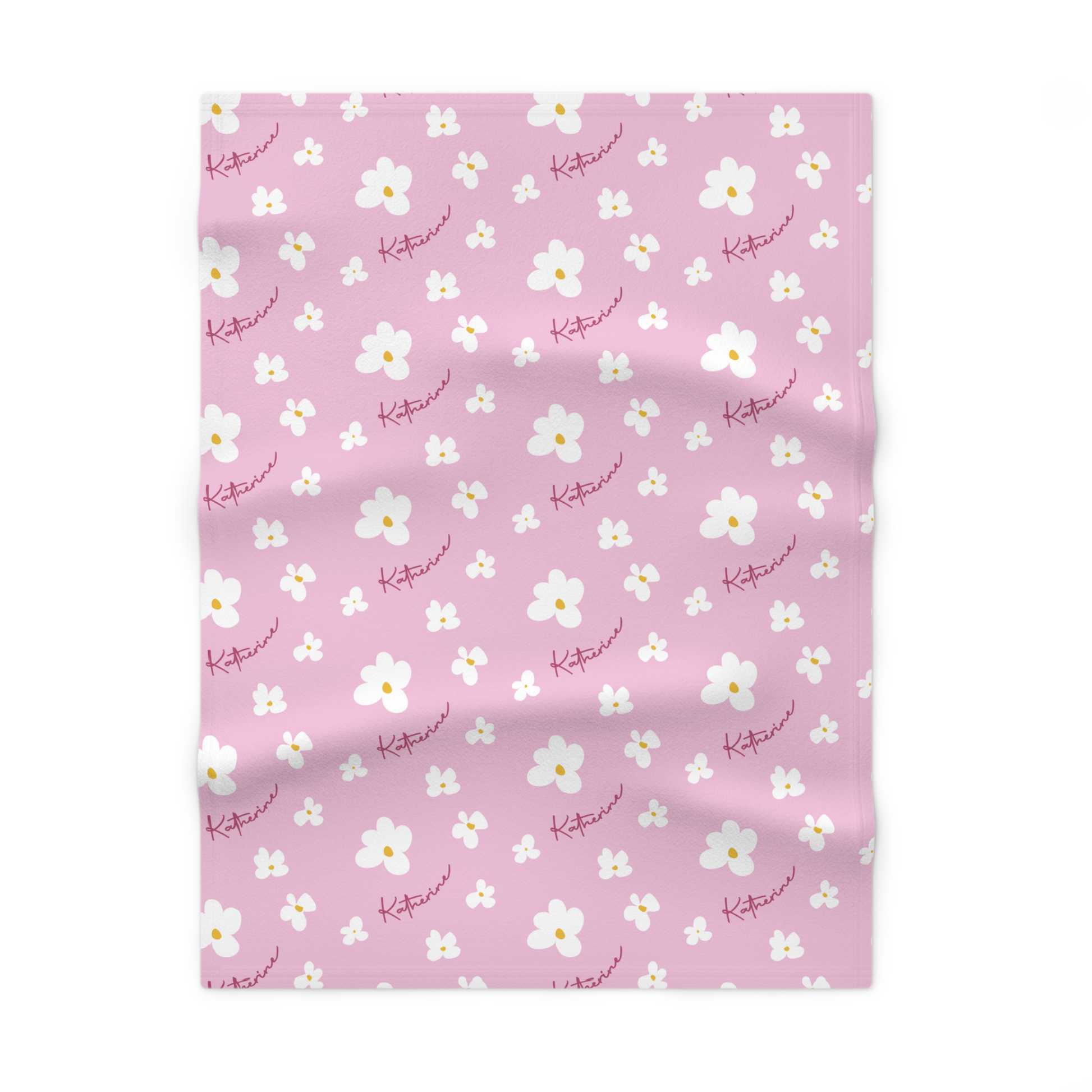 Fleece personalized baby blanket in pink daisy pattern laid flat