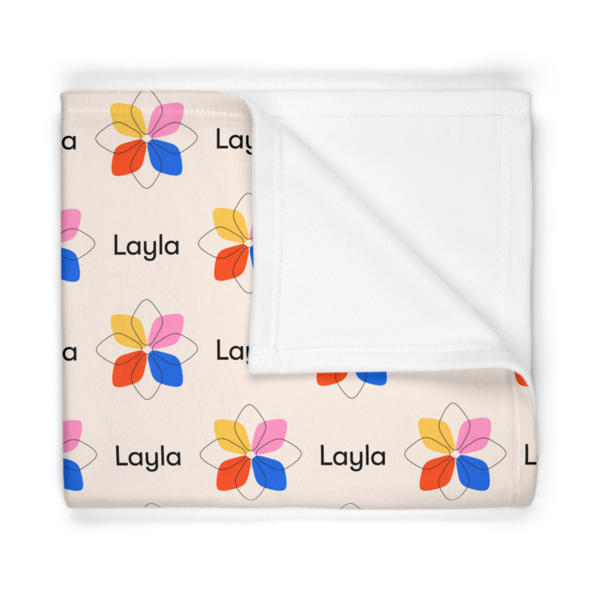 Folded fleece fabric personalized baby blanket in a multi-colored geometric boho flower pattern