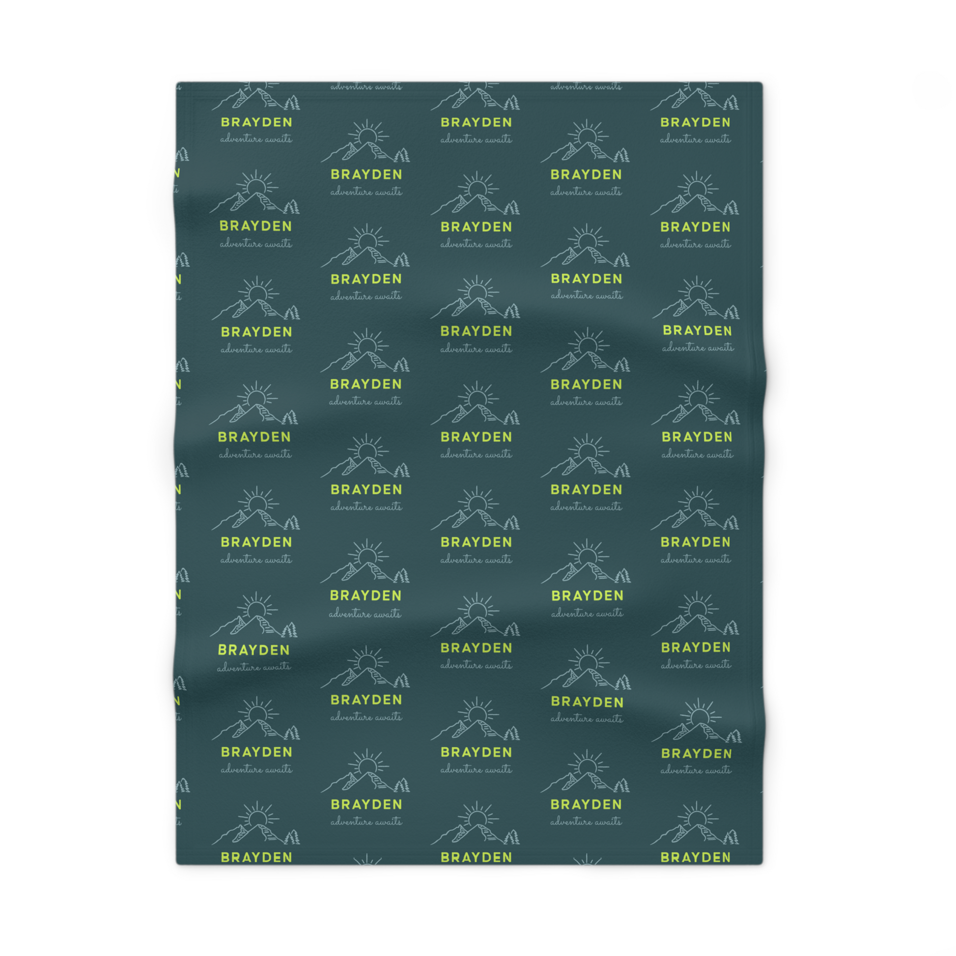 Fleece personalized baby blanket in green mountain adventure pattern laid flat