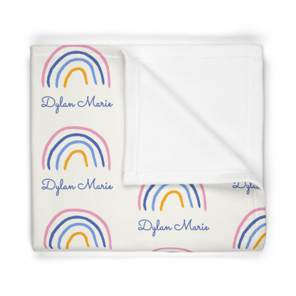 Folded fleece fabric personalized baby blanket in rainbow pattern