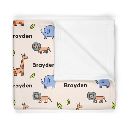 Folded fleece fabric personalized baby blanket in safari animal pattern