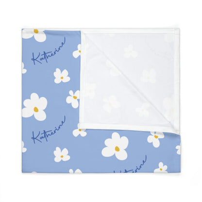 Folded jersey fabric personalized baby blanket in blue daisy pattern
